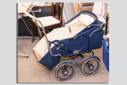 A 1930s Tan/Sad model 560 vintage twin axle canvas hooded baby's pram in good condition,