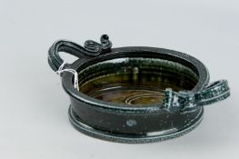 A Walter Keeler two handled oval dish, the body having a green grey mottled glaze, monogram to the