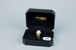 A lady's cased and boxed gold plated circular dial Fendi wristwatch having a mother of pearl dial