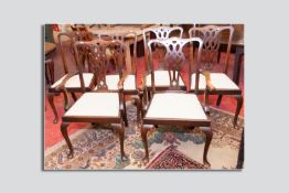A set of six (four plus two) early 20th Century Georgian style dining chairs with entwined pierced