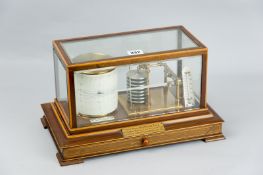 A mahogany and boxwood strung cased barograph with an eight section vacuum, recording drum and