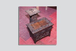 A carved Oriental stand on a four panel chamfered support depicting dragons etc and a similarly