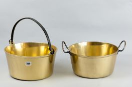 A Victorian brass jam pan with iron swing handle and another with twin iron carrying handles, 12 ins