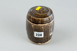 A Jim Malone lidded stoneware pot in a brown green glaze, monogram impressed to the base, 5 ins (