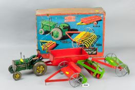 An excellent Mettoy tin plate mechanical tractor set with its original box, the clockwork