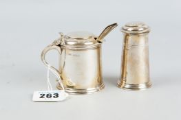 A plain capstan shaped silver lidded mustard pot with Bristol blue liner and matching capstan pepper