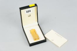 A nine carat gold plated Dunhill Swiss made cigarette lighter, no. 16714 complete in Dunhill box