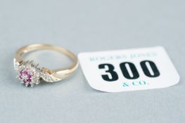 A nine carat gold ruby and diamond cluster ring with twist shoulders, 2.8 grms