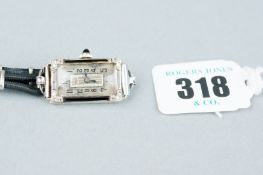 A lady's eighteen carat white gold oblong dial cocktail watch with diamond encrusted corners,