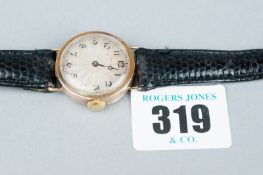 A lady's nine carat gold encased circular dial wristwatch, circa 1930s with leather strap (missing