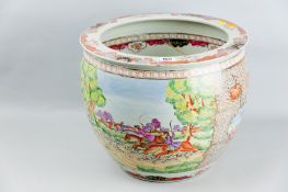 An 18th Century Famille Rose decorated fish bowl, the exterior painted with two large panels of