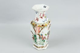 A late 18th/early 19th Century Famille Verte vase of segmented form, decorated with panels of
