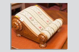 A nice quality modern mahogany footstool in the antique style, the shaped stool with applied petal