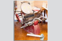 An Adana 8 x 5 hand operated printing press with a small Adana hand operated guillotine