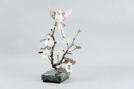 An Albany Fine China bronze and porcelain model of a Long Tailed Tit above branches of blossom,
