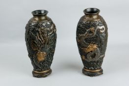 A pair of pottery pseudo lacquerwork vases having all-over embossed swirls and hearts with highly