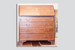An Edwardian mahogany and satinwood crossbanded fall front bureau with brass swan neck handles and
