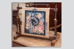 A Victorian wooden tapestry stretcher on turned columns and bun feet, 28.25 ins (71.5 cms) wide