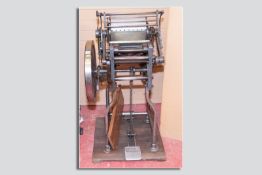 An Adana TP48 10 x 8 foot operated printing press
