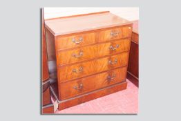 A reproduction mahogany two over three drawer chest with brass swan neck handles and escutcheons,