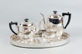 An electroplated four piece tea and coffee service on an oval galleried tray