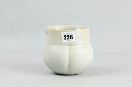 A Terry Bell-Hughes indented pot in a pale green grey glaze, signature to the base (cracked), 4