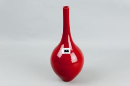 An ox blood onion shaped bottle vase with underglaze blue character mark to the base, 12 ins (30.5