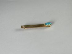 An Australian 18k gold (marked 750) and single oval opal tie-slide