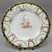 A Royal Crown Derby plate, finely painted with a centre sprig of flowers and six posies to the