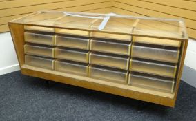 A late twentieth century light wood and glass retailer's counter display raised on a metal base with