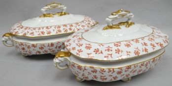A pair of Royal Worcester footed soup-tureens of shaped oval-form profusely decorated with rust