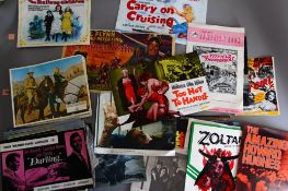 A collection of cinema memorabilia including Front of House sets, Campaign books and posters.