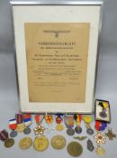 A framed Third Reich bulletin, August 1943; together with a collection of French medallion awards