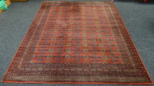 A good rust reserve Persian patterned wool carpet, 99 x 124 ins (251 x 315 cms)