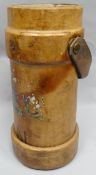 A vintage tan leather artillery carrier with rolled leather handle and bearing Royal Coat of Arms (