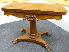 A William IV rosewood fold-over games-table. The shaped base on attractive claw-feet and with