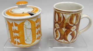An Aldermaston studio-pottery lidded preserve pot decorated in tangerine lustre; together with a