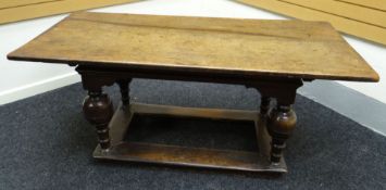 A believed to be early eighteenth century joined oak refectory table with later planked elm top,