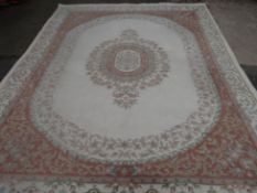 A large Chinese washed Belgian carpet with beige reserve and floral design, 108 x 142 ins (275 x 360