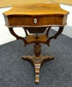 A Victorian mahogany sewing table, raised on a carved tripod base, the hinged lid revealing an