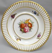 A nineteenth century Derby porcelain tureen stand of circular form and finely painted with a large
