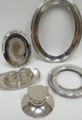 A parcel of silver items including three picture frames, a circular based inkwell, small dish etc