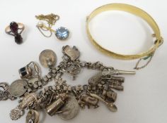 A 9ct gold metal cored bright-cut bangle; together with a 9ct yellow gold pendant set with large