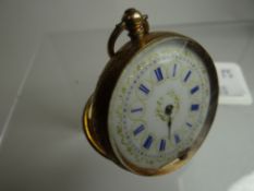 A floral engraved 14k yellow gold ladies fob watch bearing Roman numerals to the white enamel