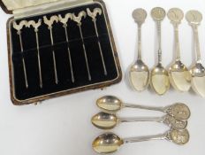 A cased set of six Sterling silver cocktail sticks with cockerel tops; together with a set of