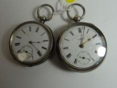 Two gent's silver antique pocket watches, both with guilloche cases and white enamel dials bearing