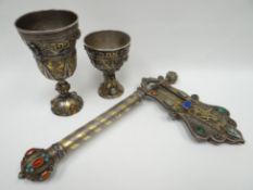 A rare Russian-Jewish silver ceremonial bejewelled and gilded Purim-rattle and wine chalice set. The
