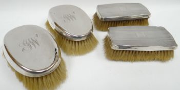 A pair of Edwardian silver-backed oval clothes-brushes with monogrammed convex backs, Chester (