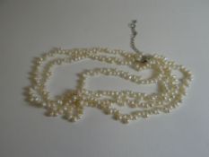 A three-strand necklet of freshwater-pearls