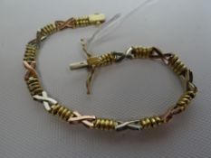 A believed gold (non hallmarked) two-tone fancy-link bracelet, 9.1gms